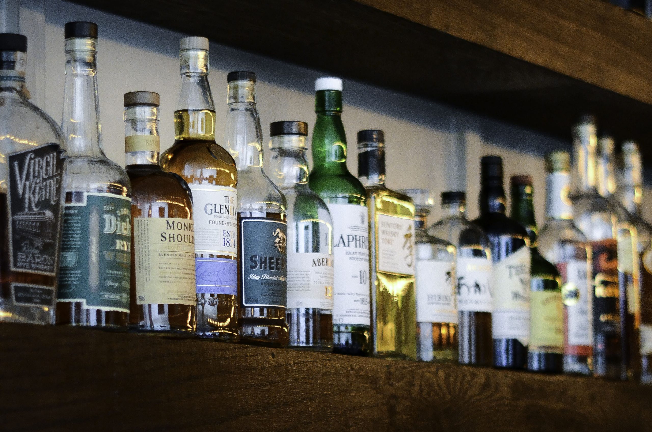 shelf with bottles of whiskey